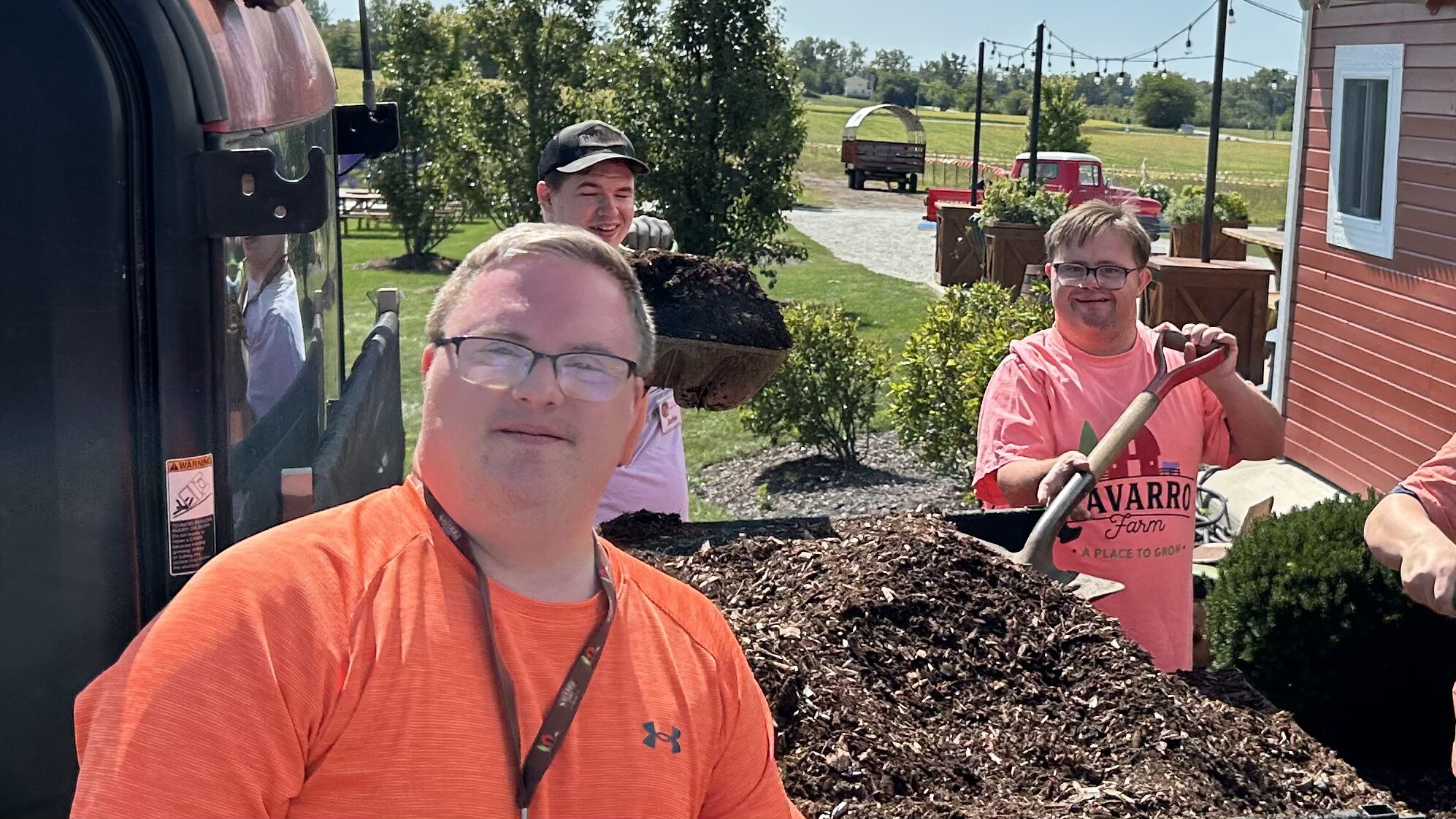 Navarro Farm farmers working, checking plants